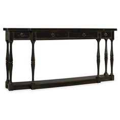 an antique console table with three drawers