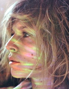 a close up of a person with long hair