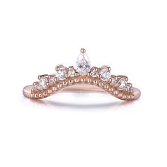 a rose gold ring with white stones