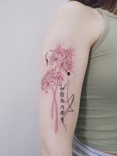 a woman with a flower tattoo on her arm