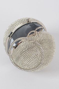 The Rhinestone Ball Clutch is the perfect accent piece for adding luxury to your ensemble. This petite and exquisite clutch is adorned with shimmering rhinestones and mixed metal, crafted with a 5W*5H*5D dimension that balances timeless glamour and elegance. Perfect for making a grand entrance. Glamorous Rhinestone Clutch For Formal Events, Glamorous Rhinestone Formal Clutch, Glamorous Crystal Evening Bag With Bling, Silver Metal Bag For Events, Glamorous Crystal Evening Bag With Rhinestones, Embellished Metal Jewelry For Formal Occasions, Glamorous Silver Metal Bag, Glamorous Silver Metal Bags, Glamorous Bling Clutch For Events