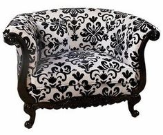 an ornate black and white chair on a white background