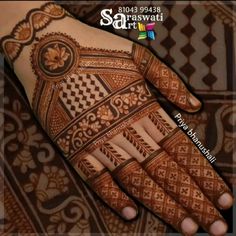 the hand is decorated with intricate designs