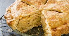 there is a pie that has been cut in half on the cooling rack with it's crust removed