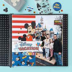 the family is posing for a photo in front of mickey mouse's vacation album