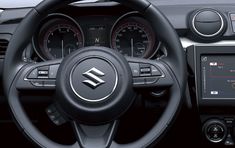 the steering wheel and dashboard of a car