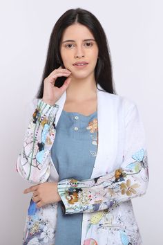 Blooming flowers digital print blazer with front open and front pockets.
Component: 1
Pattern: Digital Printed
Type Of Work: Floral Motifs
Neckline: Front Open
Sleeve Type: Full Sleeves
Fabric: Pure Linen
Color: White
Other Details: 
Front pockets
Floral motifs
Note: Top and pant worn by the model are not for sale
Occasion: Resort - Aza Fashions Floral Print Blazer, Blazer For Women, Open Blazer, Buy Linen, Flowers Digital, Open Sleeve, Linen Color, Printed Blazer, White Blazer