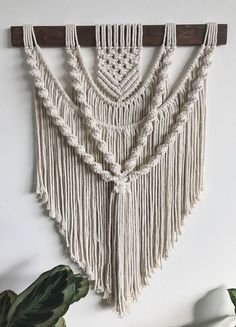 macrame wall hanging with wooden bar