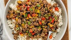 a white bowl filled with rice and ground beef