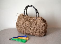 This Straw Shoulder Bag   is made of natural reeds rope yarn and with the wicker on the shoulder bag, it is very attractive for traveller and the one's looking for a gift for a your mom and your wife . With the magnetic snap and the durable material, this  straw shoulder bag can be great as a  mother's day gift to be used as a summer beach bag. There is a  interior pocket.  Mobile phone, wallet, notepad etc. slips easily into the rope summer bag. If you are looking for a everyday bulk bag, your Eco-friendly Macrame Straw Bag For Vacation, Rectangular Straw Bag With Macrame For Travel, Beige Macrame Straw Bag For Vacation, Eco-friendly Macrame Straw Bag For Beach, Beach Straw Bag With Macrame Detail, Beach Straw Bag With Macrame In Jute, Summer Natural Straw Bag With Macrame, Rectangular Summer Straw Bag With Macrame, Macrame Jute Bag For Beach