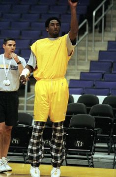 a man standing on top of a basketball court