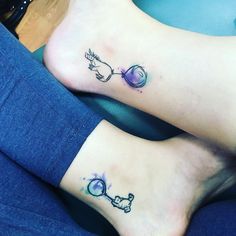 two people with matching tattoos on their feet