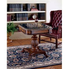 a table with chess on it in front of a bookshelf