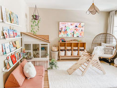 a child's playroom with toys, bookshelves and other items in it