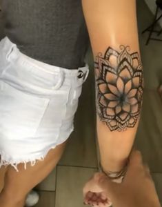 a woman with a tattoo on her leg