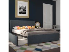 a bedroom with a bed, dresser and rug in the room on the carpeted floor