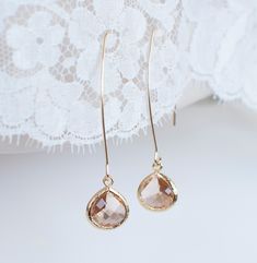 "Champagne Gold Drop Earrings. Bridal Earrings. Bridesmaid Gift. Gold Drop Earrings. Wedding Jewelry. Simple, Modern Minimalist Earrings. Materials used: - gold plated brass earwires - 17x11mm champagne glass set in gold brass frame The earrings are about 2\" long. ❤❤ ❤BRIDAL and BULK ORDERS DISCOUNT ❤ ❤❤ 15% Discount : 6 items and more (Use Coupon Code - 15DISCOFF) The earrings will arrive to you packaged ready for gift giving in a delicate white jewelry box with a silver ribbon. Back to my shop http://www.etsy.com/shop/crinadesign73 Thank you for visiting my store!" Wedding Earrings With French Hook, Wedding Earrings With French Hook In Round Shape, French Hook Wedding Earrings, Wedding French Hook Round Earrings, Minimalist Teardrop Dangle Earrings For Wedding, Minimalist Dangle Teardrop Earrings For Wedding, Elegant Teardrop Threader Earrings For Wedding, Minimalist Teardrop Wedding Earrings, Minimalist Teardrop Earrings For Wedding