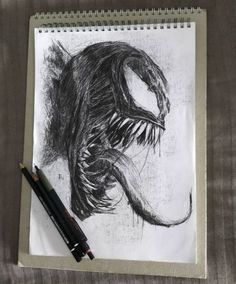 a pencil drawing of a monster with its mouth open