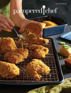 a person is dipping sauce on some fried food