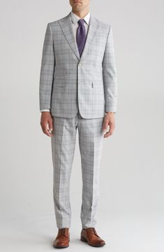 Sophisticated peaked lapels smarten the jacket of this trim-fit suit paired with flat-front trousers and finished in a handsome plaid print. 36 1/4" inseam; 7 3/4" leg opening; 10 1/2" rise (size 38R) Jacket has peaked lapels; chest welt pocket; front flap pockets Unhemmed Lined 70% polyester, 28% rayon, 2% spandex Dry clean Imported Office Sets With Slim Fit And Notch Lapel, Tailored Professional Pantsuit For Semi-formal Occasions, Single Breasted Fitted Sets For Workwear, Fitted Single Breasted Sets For Workwear, Modern Fitted Semi-formal Pantsuit, Modern Fitted Pantsuit For Semi-formal Events, Modern Fitted Pantsuit For Semi-formal Occasions, Slim Fit Business Casual Sets With Notch Lapel, Custom Fit Notch Lapel Sets For Business Casual