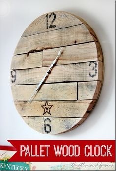 a clock made out of wood with numbers and stars on the face is hanging on a wall