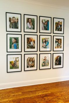 a wall with many pictures on it and a wooden floor in front of it,