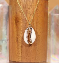 a necklace with a sea shell on it