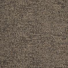 an upholstered carpet textured in brown and grey tones with small dots on the top