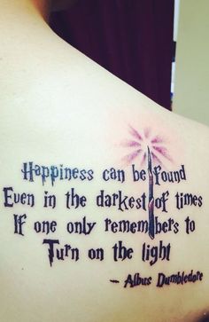 a woman with a tattoo on her back saying happiness can be found even in the darkest of times if one only remembers to turn on the light