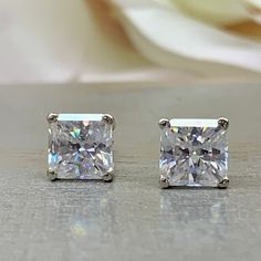 Moissanite Diamond Stud Earrings Unisex 14K Solid White Gold, Moissanite Earrings Radiant Cut 2.00 CTW, Moissanite Stud Earrings Women #7192 #MoissaniteEarrings #DiamondStuds #MoissaniteEarring #Moissanites #RadiantCut #WomensEarrings #WhiteGold #StudEarrings #14kSolid #EarringsUnisex White Princess Cut Earrings In Prong Setting, White Princess Cut Earrings With Prong Setting, Classic White Princess Cut Earrings, White Gold Radiant Cut Earrings Gift, Radiant Cut Diamond Wedding Earrings, White Cushion Cut Cubic Zirconia Earrings, White Princess Cut Earrings For Anniversary, Diamond White Radiant Cut Earrings For Anniversary, Diamond White Radiant Cut Earrings As Gift