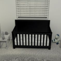 a baby crib in the corner of a room with white walls and carpeting