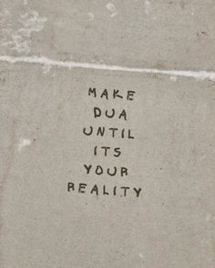 graffiti on the side of a building that says make dua until it's your reality