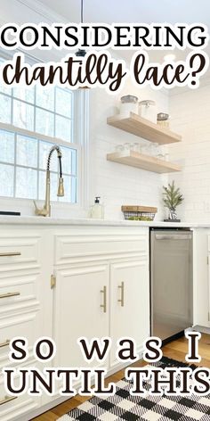 a kitchen with white cabinets and black and white checkered rug