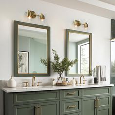 a bathroom with two sinks and mirrors on the wall