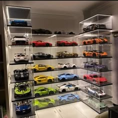 a display case filled with lots of toy cars