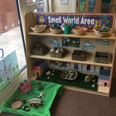 the small world area is set up for children to play with their toys and books