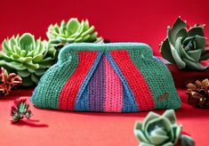 "Explore our handmade raffia crochet handbag, featuring vibrant stripes in green, red, blue, pink, and purple. This flowy bag is perfect for daily use, offering a stylish complement to any outfit. Dimensions: Upper part width: 28cm Base width: 48cm Height: 28cm With its spacious design and colorful stripes, it effortlessly combines fashion and functionality. Ideal for both casual outings and chic ensembles, it's a must-have accessory this season." Handmade Multicolor Crochet Clutch Bag, Spring Multicolor Crochet Shoulder Bag, Handmade Multicolor Crochet Bag For Spring, Raffia Crochet, Crochet Handbag, Flowy Design, Crochet Handbags, Green Stripes, Clutch Handbag