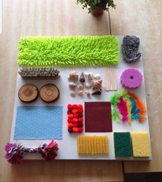 a table topped with lots of different types of crafting supplies