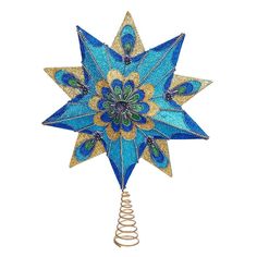 a blue and gold christmas ornament with spirals