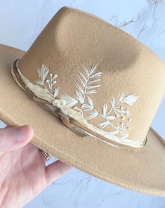 "Hand embroidered, unique, floral embroidered wide brim felt hats. Custom designed hats!  hoods between hat colors, design and band options. These are great hats for family photos, concerts, outdoor get togethers, vacation, sun hat, and more! Super cute and stylish for all occasions.   Listing is split by design and hat color (I.e. black #1 is a black hat with design #1)  Hat details:  65% cotton, 35% polyester One size,but fits all most women Adjustable strap inside of the fedora hat Hat Circumference: 56-58cm/22-22.8\"; Brim Width: 7cm/2.76\"；Height: 11cm/4.3\". if you do not want desired band option-simple black leather band will be provided. FREE SHIPPING" Embroidered Felt Hat, Embroidered Cowboy Hat, Felt Hats For Women, Hat Embellishments, Black Wide Brim Hat, Cowboy Hat Design, Hat Burning, Wide Brim Felt Hat, Custom Cowboy Hats