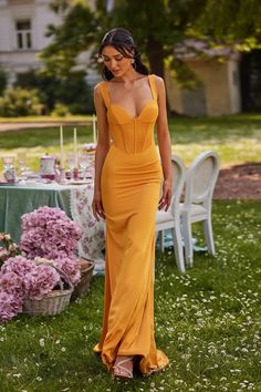 In Bloom - the Made-To-Order Collection A minimalist aesthetic allows all the focus to fall on you in the Blinera Gown. Structured with a boned bodice, thick straps & a body-hugging silhouette. Rendered from an amber-toned satin fabric for a romantic appeal. What is a Made-To-Order? This product is a made-to-order item. Made-to-order items are not held in physical stock and production commences AFTER order placement. We try to limit production and stock levels and as such, made-to-order items pr Fitted Bodice Dress With Built-in Bra And Underwire, Elegant Corset Dress With Built-in Underwire Bra, Underwire Corset Dress With Lined Fitted Bodice, Fitted Dress With Lined Bodice And Underwire, Fitted Gown With Spaghetti Straps And Lined Bodice, Orange Formal Dresses, Dress Code For Women, Matric Dress, White Statement Earrings