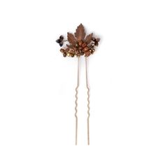 This elegant hairpin showcases a vintage copper-plated maple leaf, capturing the vibrant colors of fall. The leaf is delicately enclosed by Czech fire-polished beads, each bead marbled with rich earthy tones of browns, golds, and warm autumn shades.  Scattered among them are shimmering Austrian crystals and other intricate beads, adding a touch of sparkle. The mix of textures and colors perfectly complements the warm, cozy essence of the season, making this hairpin a stunning accent for autumnal styles. Style P007 - Maple Gleam Pin This item is meticulously handcrafted in our studio located in the USA. The listing is for one maple leaf pin. Materials: - durable 24 karat gold-plated brass hairpin - vintage copper plated brass maple leaf - variety of Czech glass lampwork beads - Austrian cry Whimsical Hair, Copper Fall, Autumn Bridal, Colors Of Fall, Simple Leaf, Glass Lampwork, Bridal Headpiece, Warm Autumn, Copper Plated