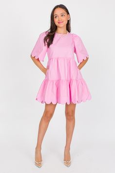 This dress is precious! Poplin pink fabric with a tiered silhouette and a sweet scallop trim along the hem and sleeves. Side pockets complete the look. Dress is lined and has a back zip closure. Scallop Trim, Blue Door, Poplin Dress, Pink Fabric, Dress Pink, Boutique Clothing, Cute Dresses, Pink Dress, Trim