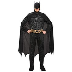 a man in a batman costume standing with his hands on his hips