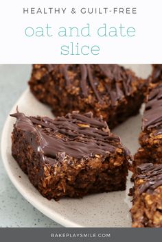 a plate that has some kind of dessert on it with chocolate frosting and nuts