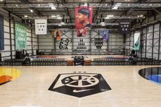 an indoor basketball court with tables and benches