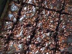 chocolate brownies with sprinkles are on a baking sheet, ready to be baked