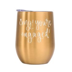 a gold wine glass with the words,'song you're engaged'written on it