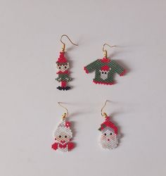 four christmas ornaments are shown on a white surface