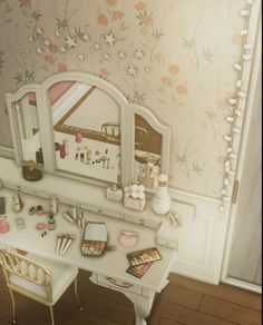 a desk and chair in a room with floral wallpaper on the walls behind it